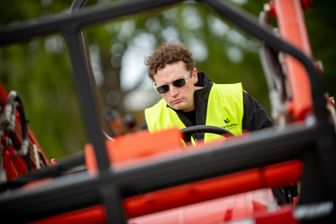 Photo of contestant driving tractor